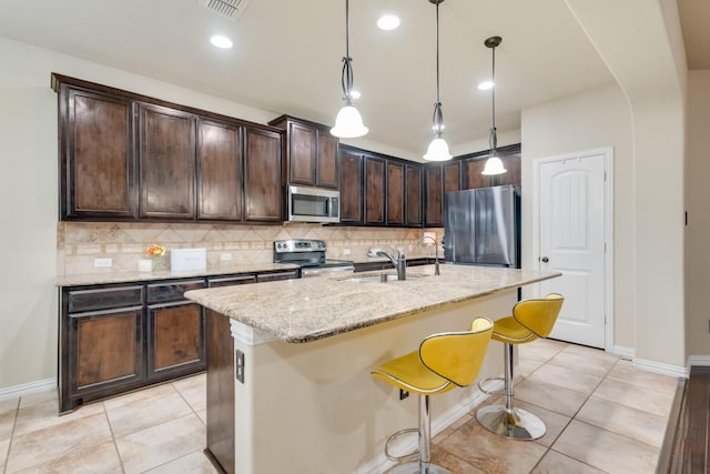 2015 Diamondback, Forney, TX 75126 - kitchen with appliances with stainless steel finishes, a sink, backsplash, light tile patterned floors, and recessed lighting