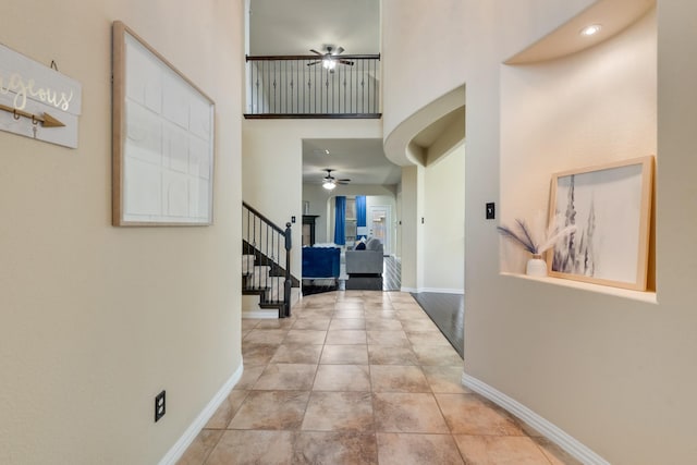 2015 Diamondback, Forney, TX 75126 - corridor featuring a towering ceiling, stairway, and baseboards
