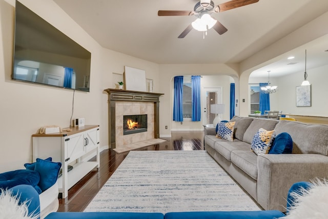 2015 Diamondback, Forney, TX 75126 - living area with a chandelier, a fireplace, dark wood-type flooring, ceiling fan, and baseboards