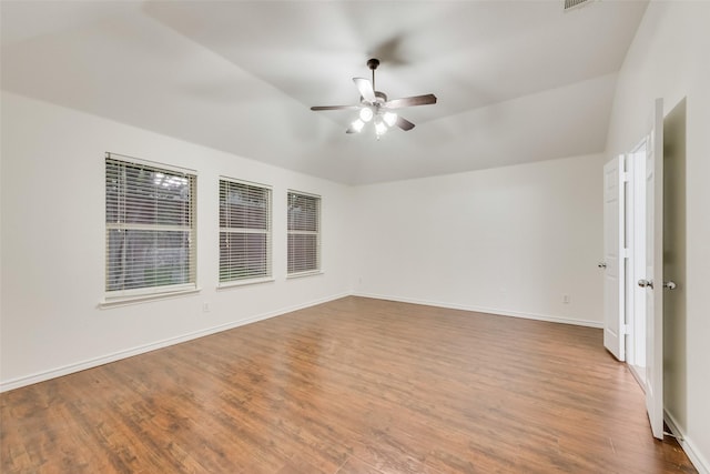 8008 Elk Mountain Trl, Mckinney, TX 75070 - spare room featuring a ceiling fan, wood finished floors, baseboards, and vaulted ceiling