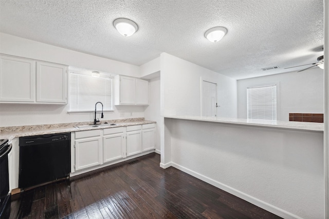 2634 Pinta Cir, Grand Prairie, TX 75052 - kitchen featuring black appliances, a sink, baseboards, dark wood finished floors, and light countertops