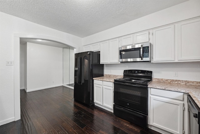 2634 Pinta Cir, Grand Prairie, TX 75052 - kitchen with black appliances, light countertops, dark wood-type flooring, a textured ceiling, and arched walkways