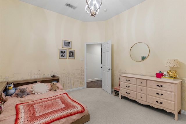 bedroom with light colored carpet, baseboards, and a chandelier