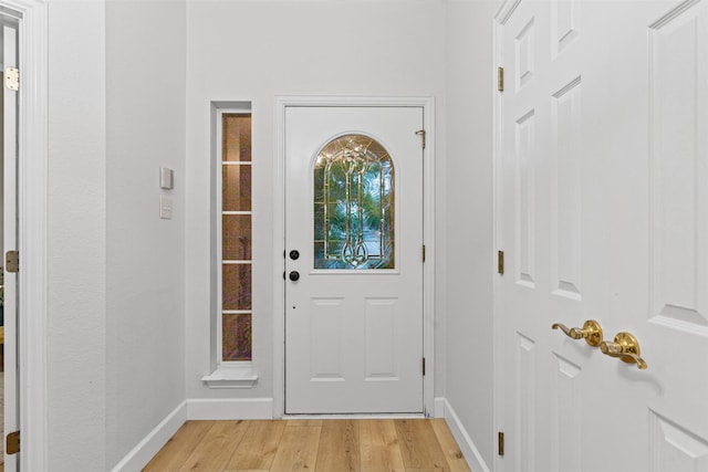 entryway featuring light wood-style flooring and baseboards