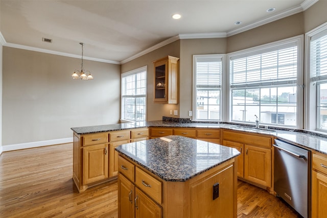 2813 Welborn St, Dallas, TX 75219 - kitchen with stainless steel dishwasher, a sink, light wood-type flooring, a kitchen island, and a chandelier