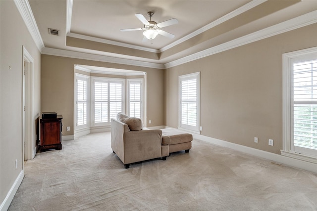 2813 Welborn St, Dallas, TX 75219 - living room with healthy amount of natural light, light colored carpet, a raised ceiling, and crown molding
