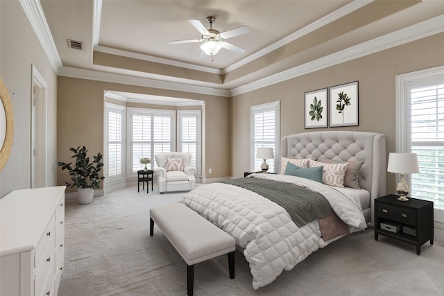 2813 Welborn St, Dallas, TX 75219 - bedroom with light colored carpet, a raised ceiling, ornamental molding, and ceiling fan
