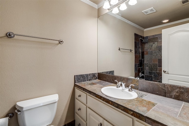 2813 Welborn St, Dallas, TX 75219 - bathroom with toilet, vanity, crown molding, and tiled shower