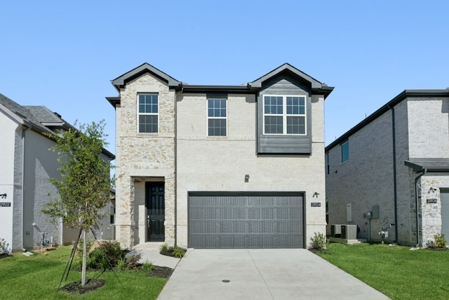 view of front of property featuring an attached garage, concrete driveway, a front yard, cooling unit, and brick siding