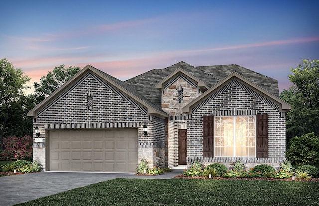 french country home with stone siding, driveway, a garage, and brick siding