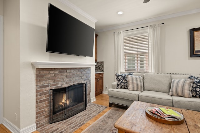 3208 Cole Ave Unit 2304, Dallas, TX 75204 - living area with a fireplace, crown molding, light wood-style flooring, baseboards, and recessed lighting