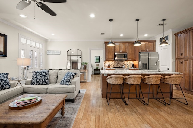 3208 Cole Ave Unit 2304, Dallas, TX 75204 - living room with ornamental molding, a ceiling fan, light wood-style flooring, and recessed lighting