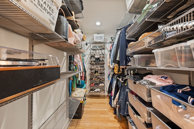 3208 Cole Ave Unit 2304, Dallas, TX 75204 - walk in closet with wood finished floors