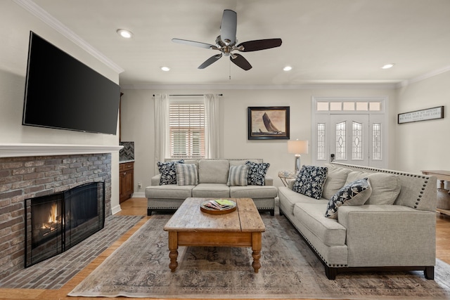3208 Cole Ave Unit 2304, Dallas, TX 75204 - living area with crown molding, ceiling fan, a brick fireplace, recessed lighting, and wood finished floors