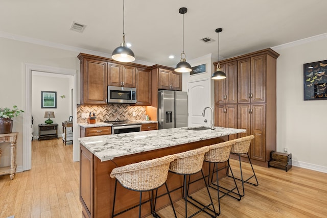 3208 Cole Ave Unit 2304, Dallas, TX 75204 - kitchen featuring appliances with stainless steel finishes, a sink, baseboards, decorative backsplash, and ornamental molding