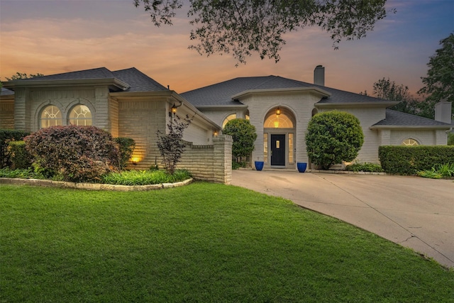 4119 Timbersedge Trl, Arlington, TX 76015 - view of front of property with driveway, a chimney, a lawn, an attached garage, and roof with shingles