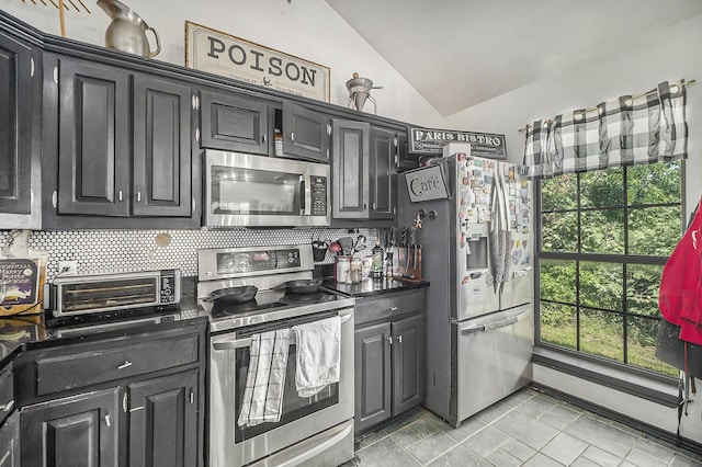 7508 Lake Highlands Dr, Fort Worth, TX 76179 - kitchen with stainless steel appliances, backsplash, vaulted ceiling, and dark cabinets