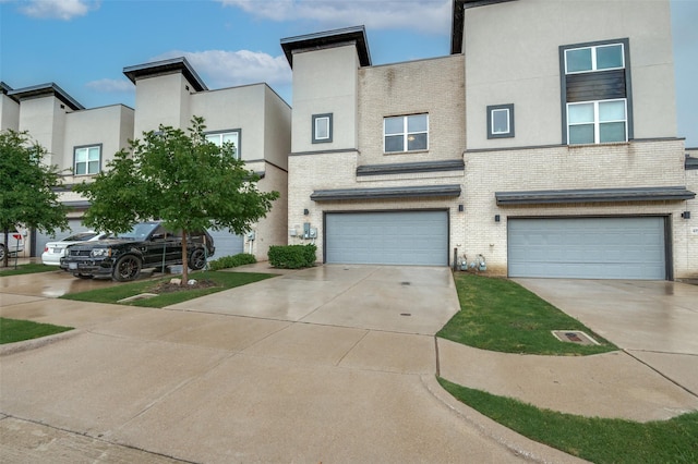 4354 Hebron St, Irving, TX 75061 - view of front facade featuring a garage, brick siding, stucco siding, and concrete driveway