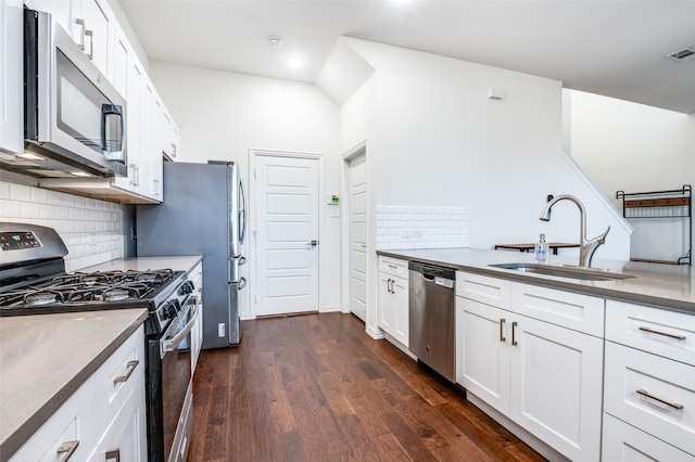 4354 Hebron St, Irving, TX 75061 - kitchen featuring stainless steel appliances, a sink, tasteful backsplash, dark wood finished floors, and white cabinets