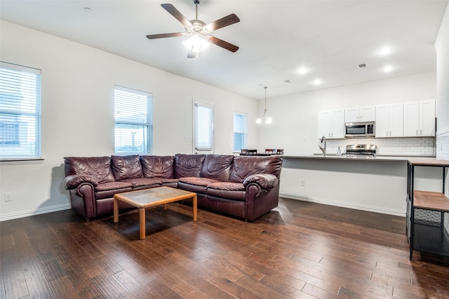 4354 Hebron St, Irving, TX 75061 - living room with a ceiling fan, dark wood-type flooring, baseboards, and recessed lighting