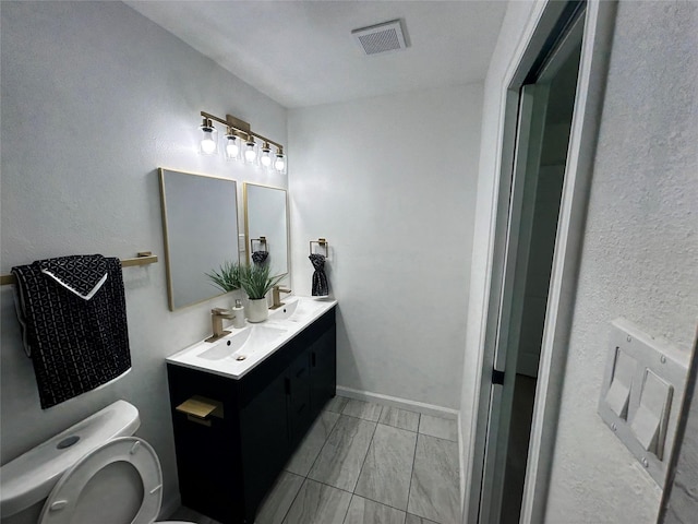 1034 Shawnee Trce, Grand Prairie, TX 75051 - bathroom featuring double vanity and toilet