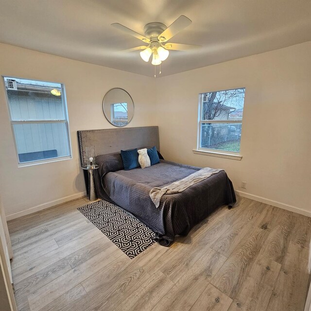 1034 Shawnee Trce, Grand Prairie, TX 75051 - bedroom with wood finished floors and a ceiling fan