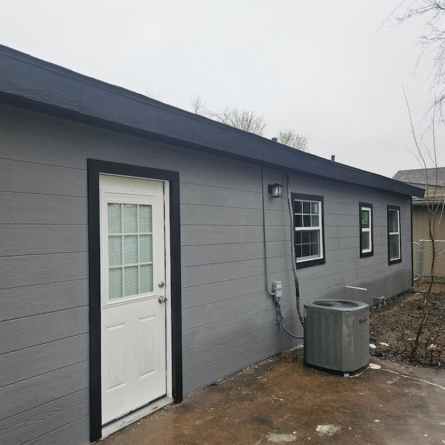 1034 Shawnee Trce, Grand Prairie, TX 75051 - view of side of property with a central air condition unit