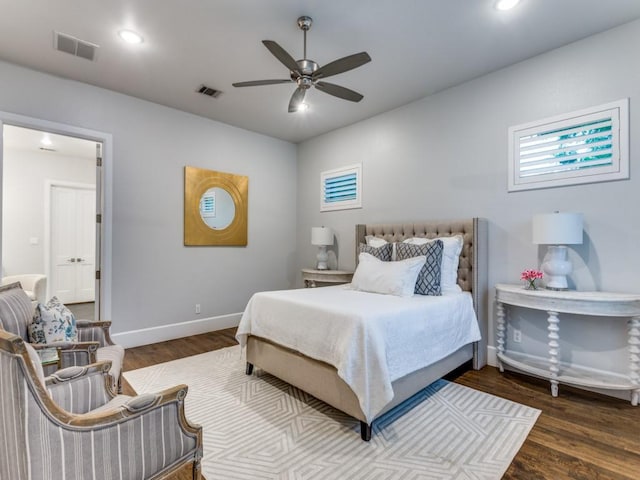 bedroom featuring wood finished floors, baseboards, recessed lighting, and ceiling fan