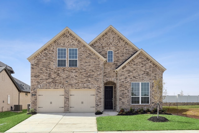 737 Fencecrow Trl, Celina, TX 75009 - view of front of property with central AC unit, an attached garage, brick siding, driveway, and a front lawn