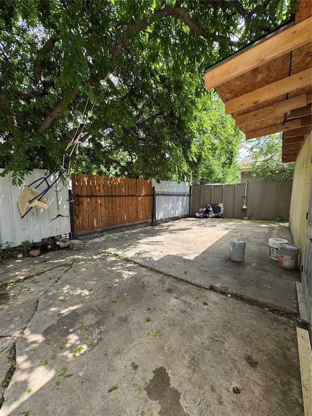 view of patio / terrace with fence and a gate