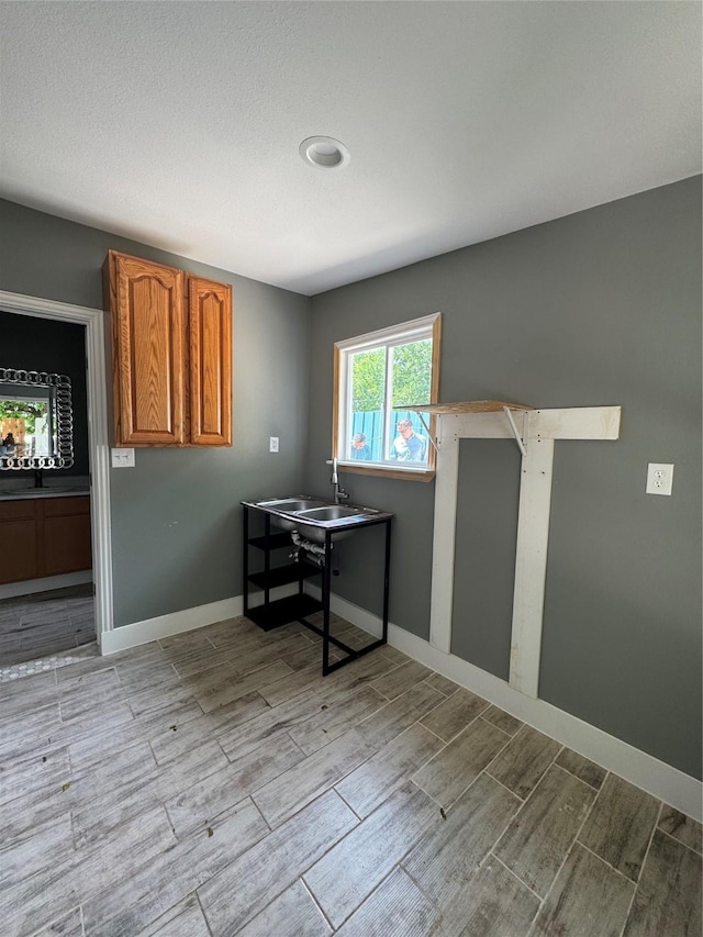 dining space featuring wood tiled floors and baseboards