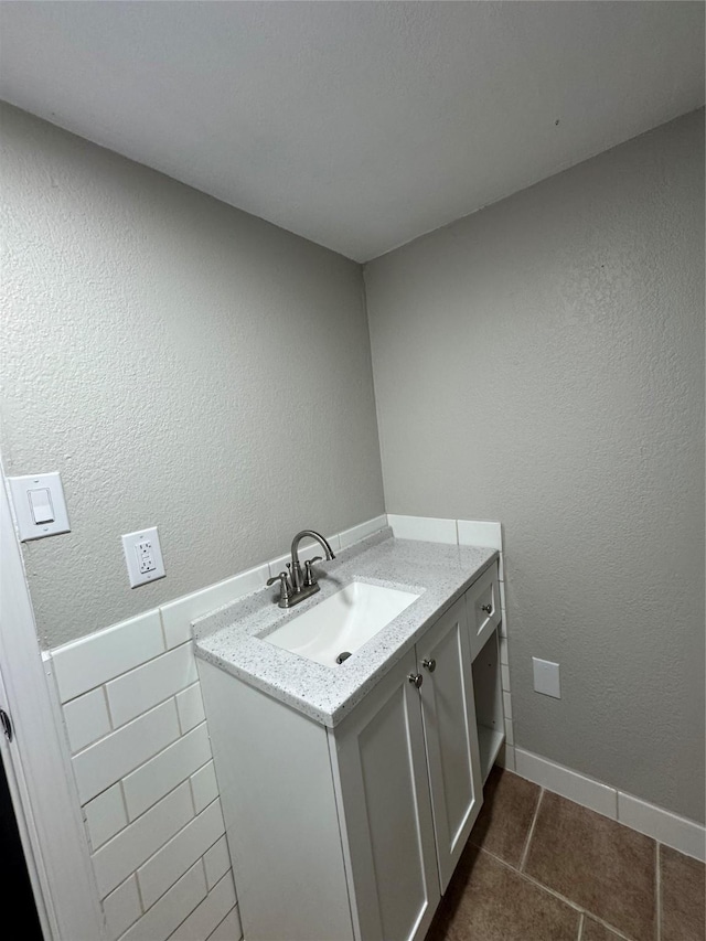 bathroom with vanity and tile patterned flooring