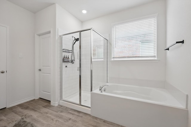 3409 Brady Starr Dr, Aubrey, TX 76227 - bathroom featuring a stall shower, a garden tub, and wood finished floors