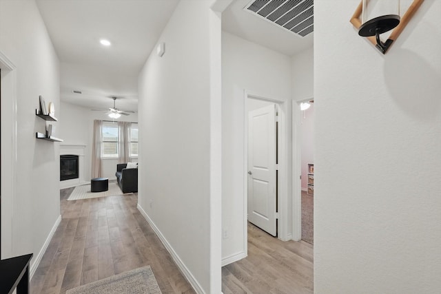3409 Brady Starr Dr, Aubrey, TX 76227 - hallway featuring light wood-style flooring, baseboards, and recessed lighting