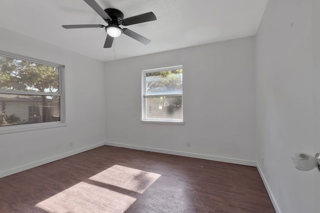 unfurnished room featuring wood finished floors, a ceiling fan, and baseboards