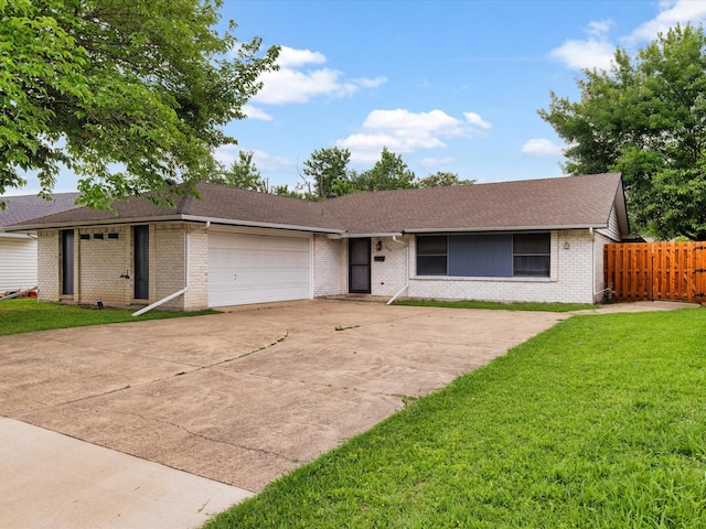 424 Woodmere Dr, Garland, TX 75043 - ranch-style house with an attached garage, brick siding, concrete driveway, and a shingled roof