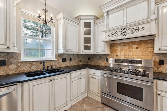 22924 County Road 223, Arp, TX 75750 - kitchen with appliances with stainless steel finishes, a sink, dark countertops, a chandelier, and pendant lighting