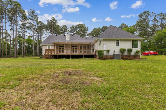 22924 County Road 223, Arp, TX 75750 - rear view of house featuring ceiling fan, a wooden deck, a lawn, and central AC unit