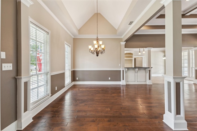 22924 County Road 223, Arp, TX 75750 - unfurnished dining area featuring a chandelier, plenty of natural light, dark wood finished floors, lofted ceiling, and decorative columns