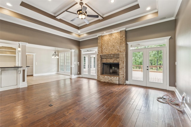 22924 County Road 223, Arp, TX 75750 - unfurnished living room featuring french doors, a ceiling fan, crown molding, a high ceiling, and a fireplace
