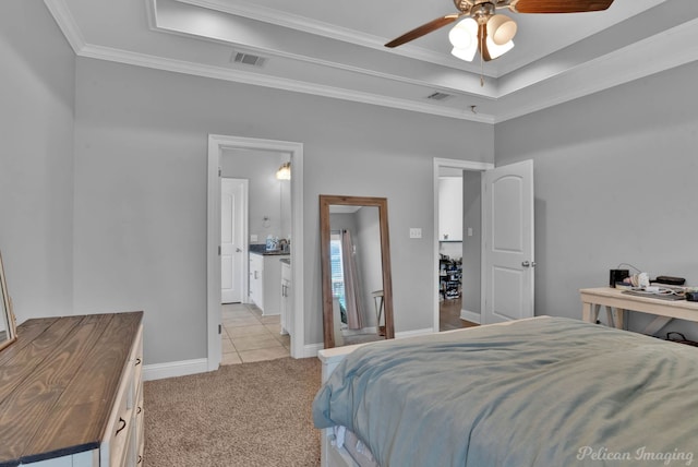 bedroom featuring a tray ceiling, crown molding, light carpet, baseboards, and ceiling fan