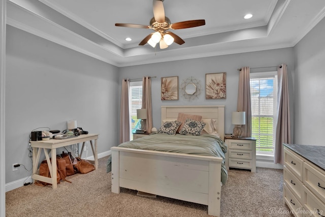 bedroom featuring a tray ceiling, light carpet, ornamental molding, recessed lighting, and a ceiling fan