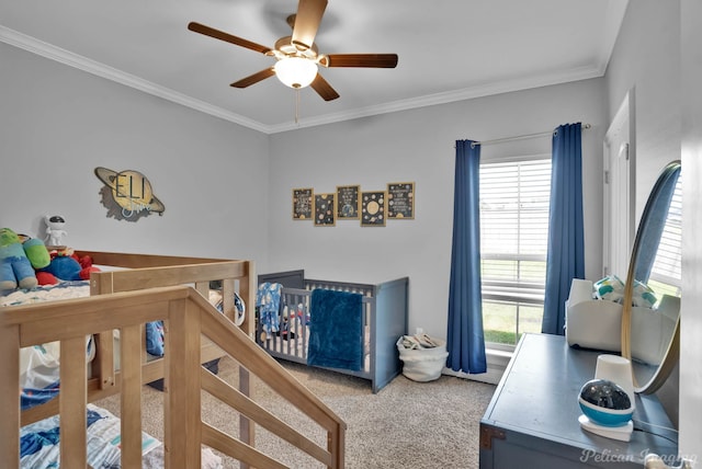 bedroom featuring multiple windows, crown molding, carpet floors, and ceiling fan