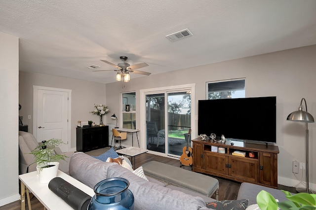 14070 Rucker St, Azle, TX 76020 - living room featuring wood finished floors, baseboards, and ceiling fan