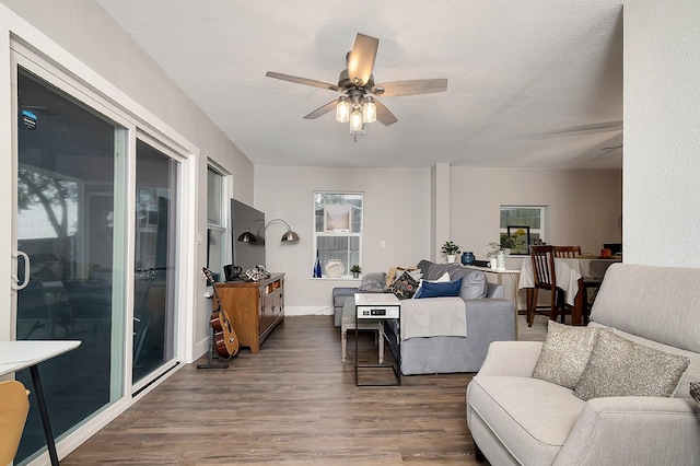 14070 Rucker St, Azle, TX 76020 - living area with a ceiling fan, wood finished floors, and baseboards