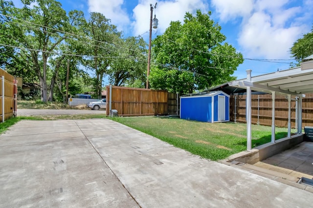 14070 Rucker St, Azle, TX 76020 - view of yard featuring a storage unit, an outbuilding, and a patio
