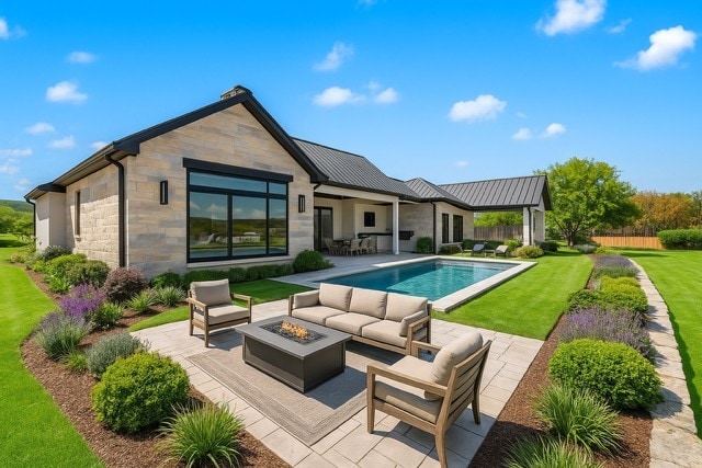 1003 Briar Cir, Possum Kingdom Lake, TX 76449 - rear view of property featuring an outdoor living space with a fire pit, a patio area, a standing seam roof, and stone siding