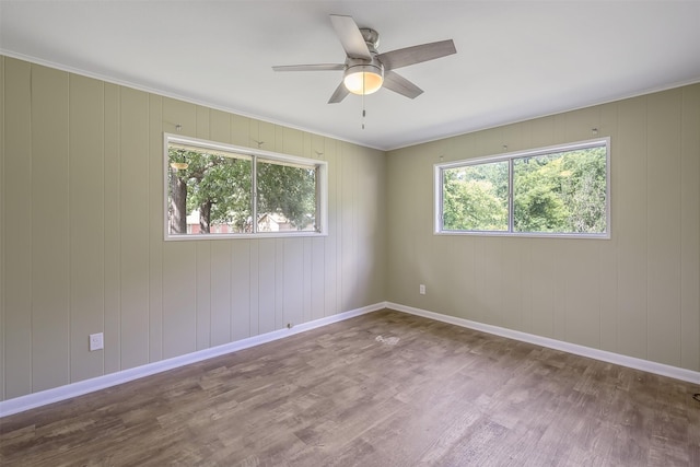 1621 Baseball Loop, Diana, TX 75640 - unfurnished room with wood finished floors, ceiling fan, and baseboards