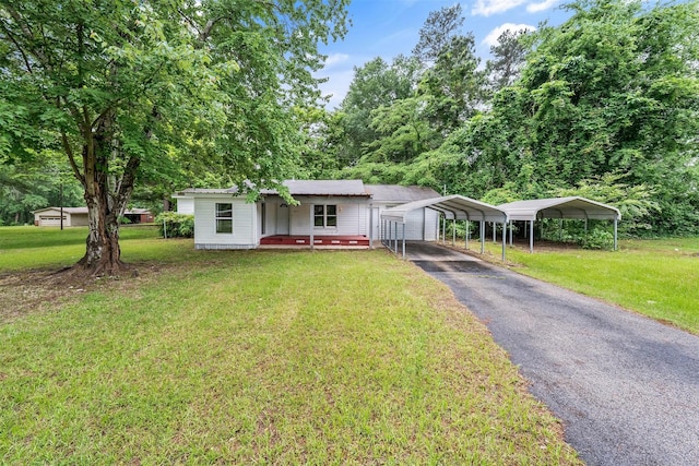 1621 Baseball Loop, Diana, TX 75640 - view of front of property featuring driveway, a carport, a front lawn, and covered porch