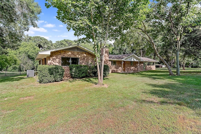 1621 Baseball Loop, Diana, TX 75640 - view of grassy yard featuring central air condition unit